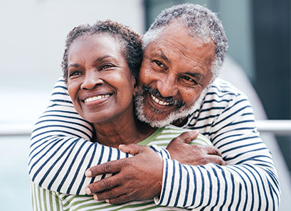 Photo of a man and woman smiling for a picture. Link to Life Stage Gift Planner Ages 45-65 Situations.
