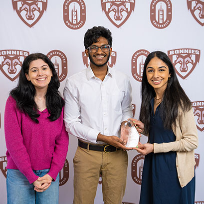 PHoto of three students smiling together. Gifts of Appreciated Securities