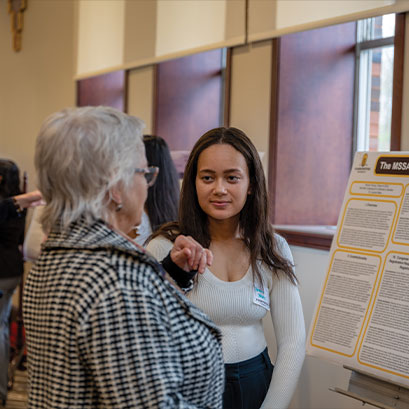 Photo of two people talking. Link to Beneficiary Designations.