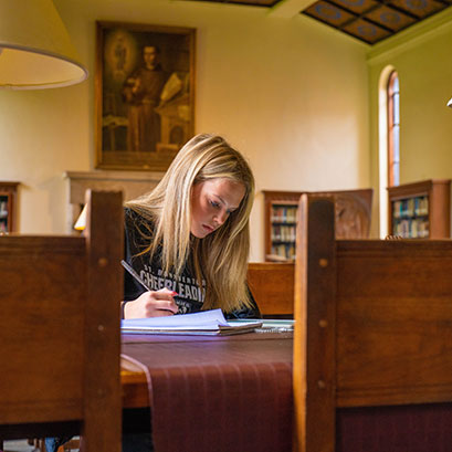 A student studying in the library. Tangible Personal Property